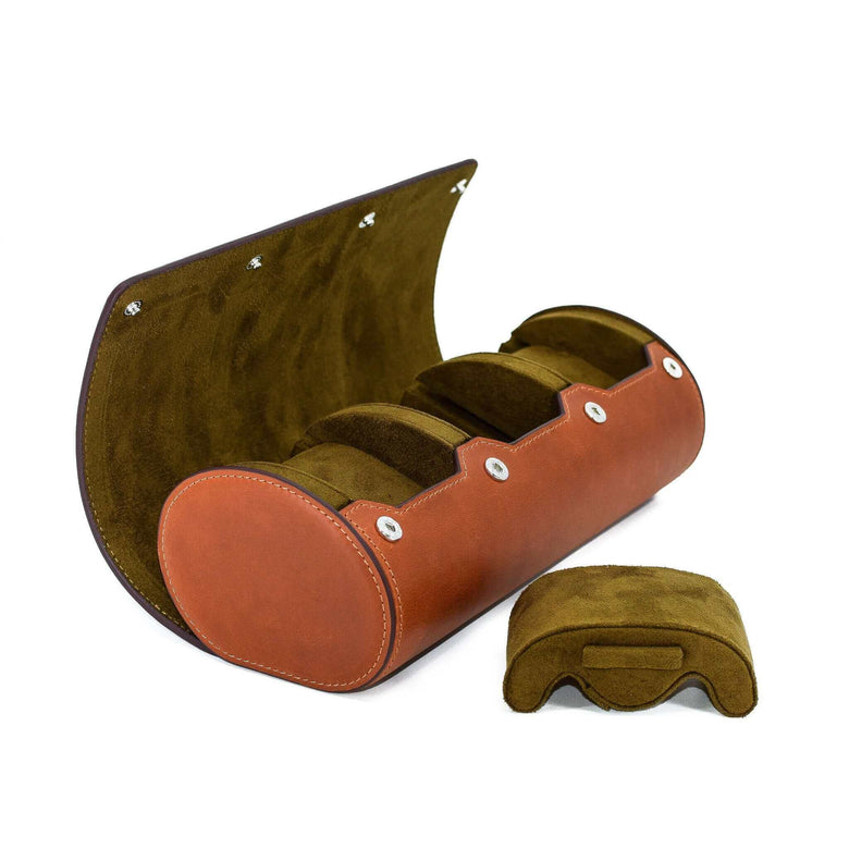 A side view showing the compressible watch pillow removed from Luxury Watch Roll's triple slot, vintage brown leather watch roll for three watch storage.